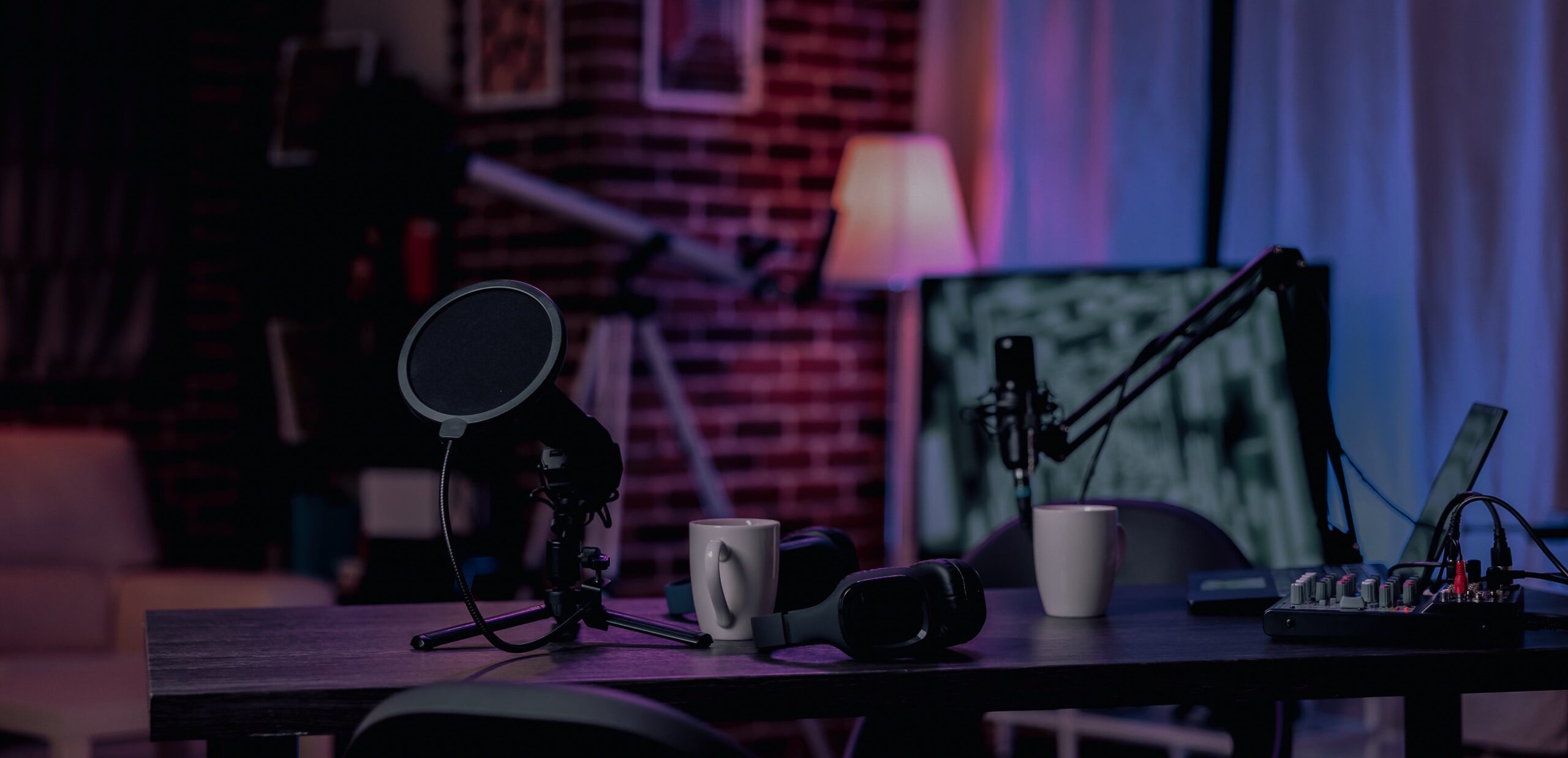 nobody-empty-desk-with-streaming-equipment-broadcast-live-conversation-social-media-no-people-space-with-podcast-station-microphone-headphones-sound-production-min-1